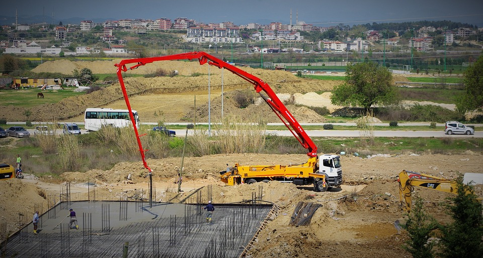 A truck-mounted crane at a construction site