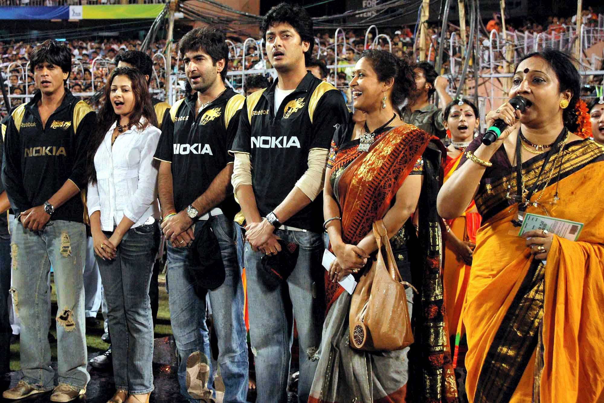 Kolkata : Kolkata Knight Riders owner Shahrukh Khan alongwith Tollywood actor and actress jointly Singing National Anthem to observe birth anniversary of Rabindra Nath Tagore at Eden Gardens in Kolkata on Thursday evening. PTI Photo by Swapan Mahapatra